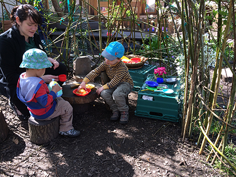 Eating in the Willow House in the garden at Acorns Nursery School Cirencester