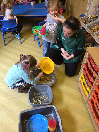 Clearing the plates at Acorns Nursery School Cirencester.