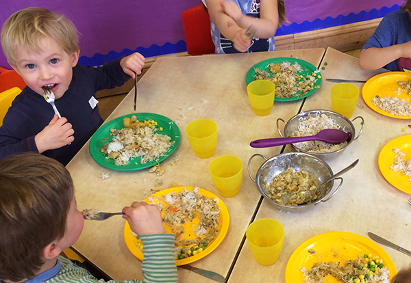 The pre-school eating their lunch Acorns Nursery School in Cirencester.