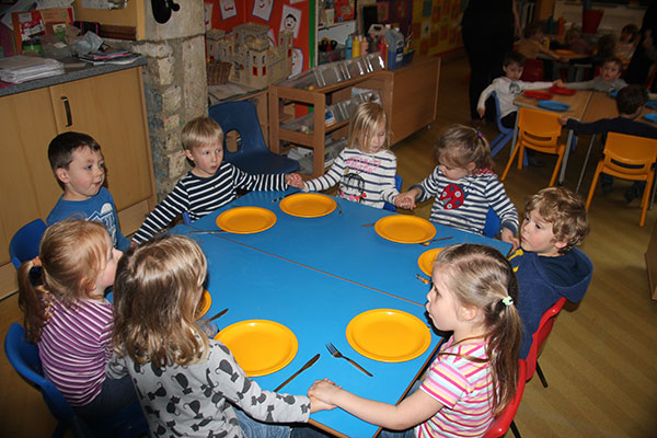 Saying thank you for the food at Acorns Nursery School in Cirencester.
