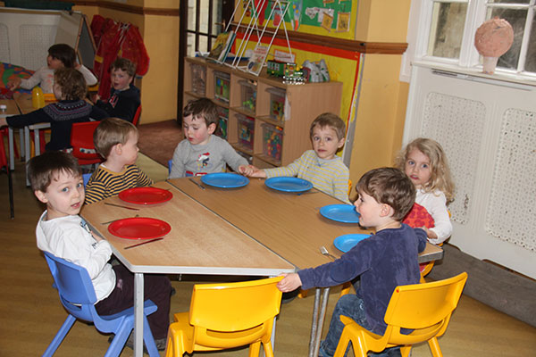 Saying thanks for the food at Acorns Nursery School in Cirencester.