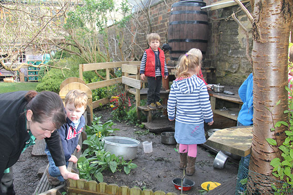 The mud kitchen garden at Acorns Nursery School Cirencester