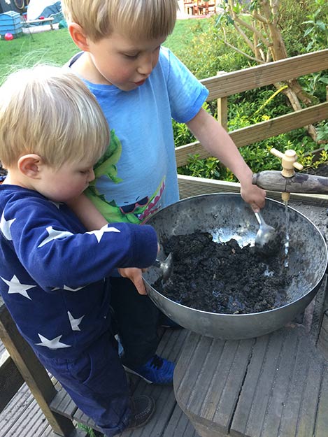 The mud kitchen in the garden at Acorns Nursery School Cirencester