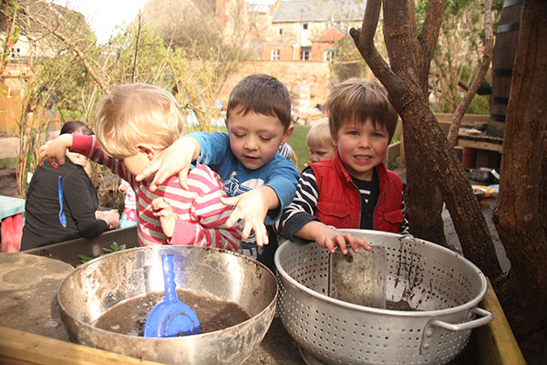 The mud kitchen in the garden at Acorns Nursery School Cirencester