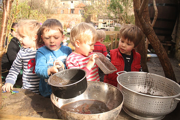 The mud kitchen in the garden at Acorns Nursery School Cirencester