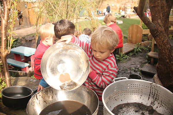 The mud kitchen in the garden at Acorns Nursery School Cirencester