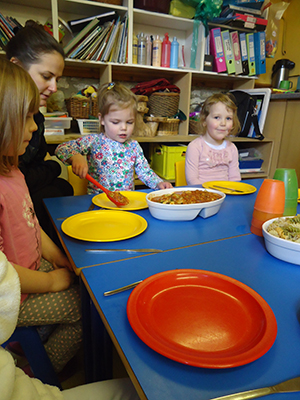 Serving the pasta at Acorns Nursery School, Cirencester.