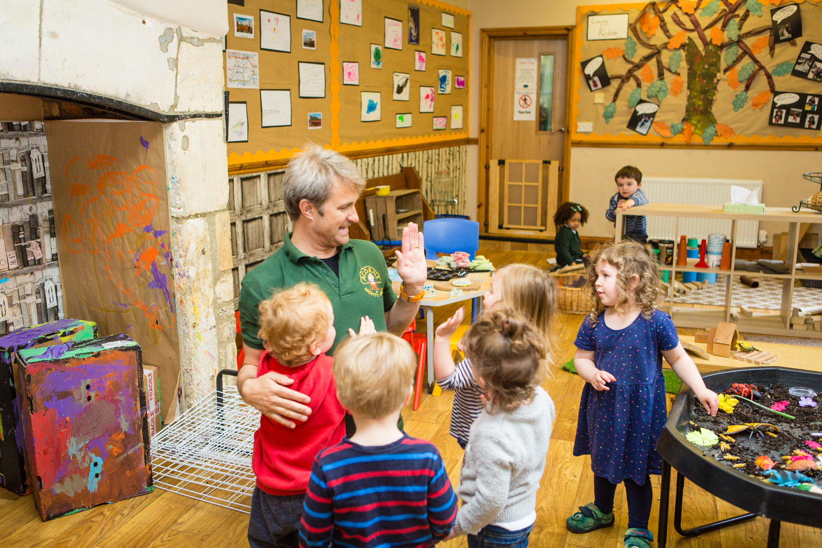 Hi-Fives with Miles in the preschool at Acorns Nursery School Cirencester.