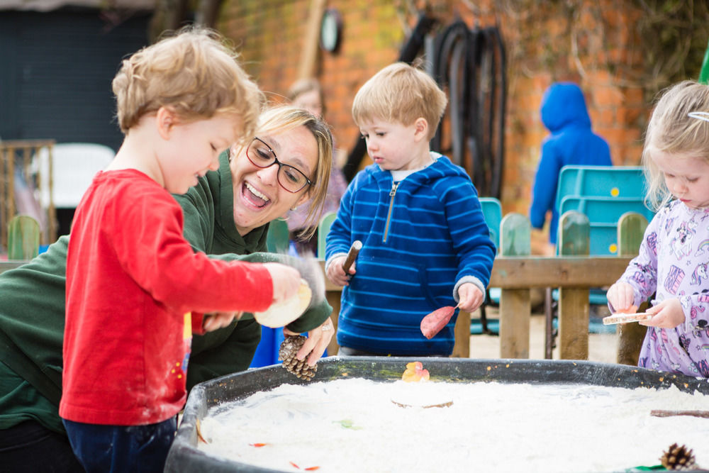 Some of the Toddlers playing outside at Acorns Nursery Cirencester