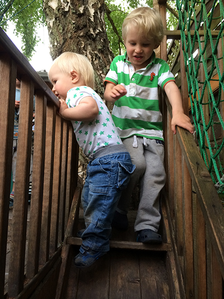 Feeding the lambs in the garden at Acorns Nursery School Cirencester